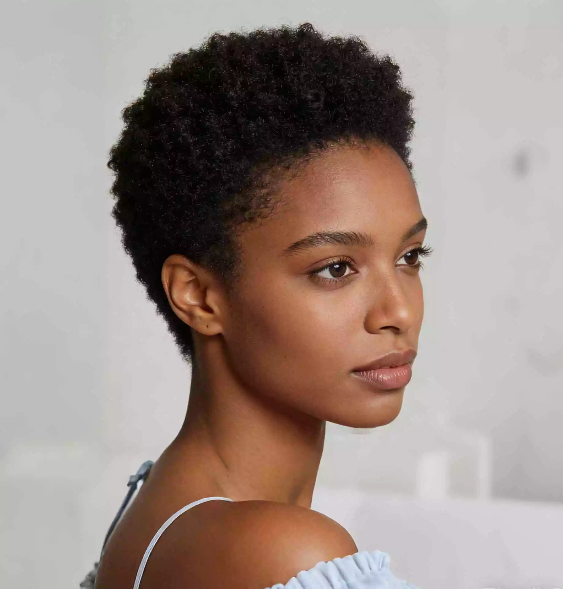 close twa hairstyle for black women with compact short length, clean perimeter, and a sharper natural silhouette