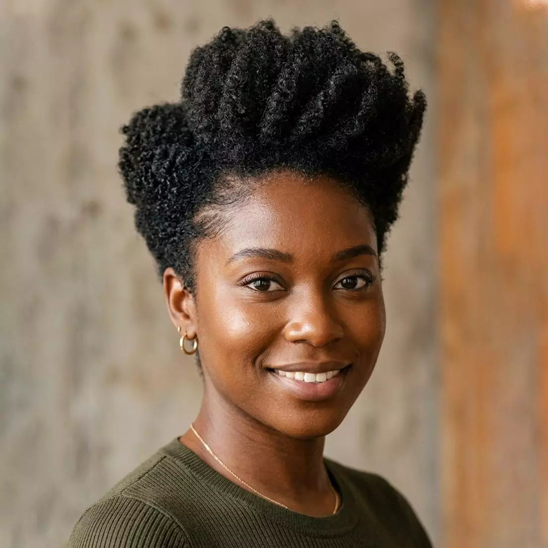 crown-volume tapered natural hairstyle for black women with lifted top shape and neat shorter perimeter
