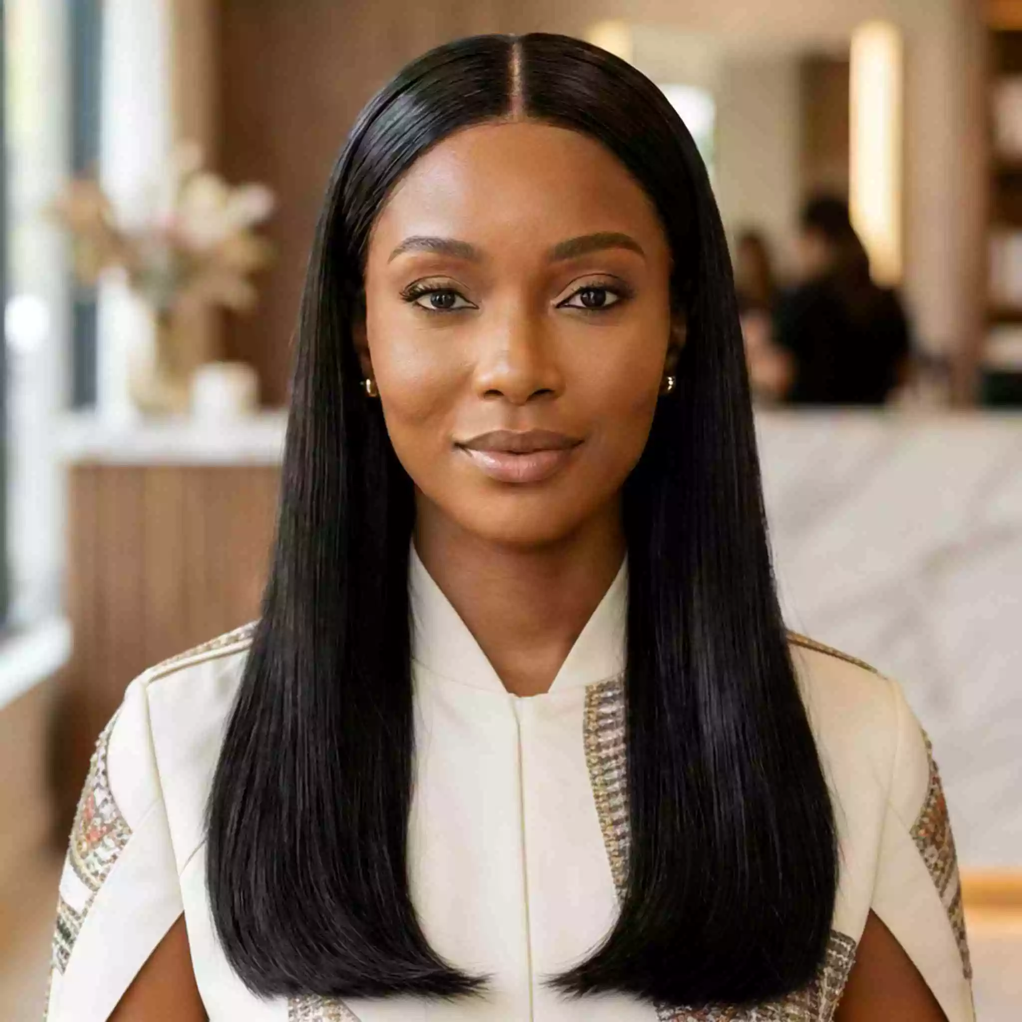 center-part sleek weave for black women with smooth finish, center part, and symmetrical polished line