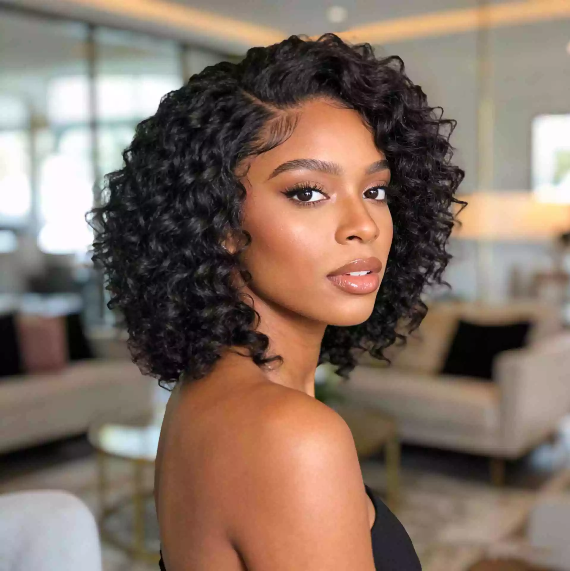 curly sew-in for black women with defined texture, fuller outline, and soft movement