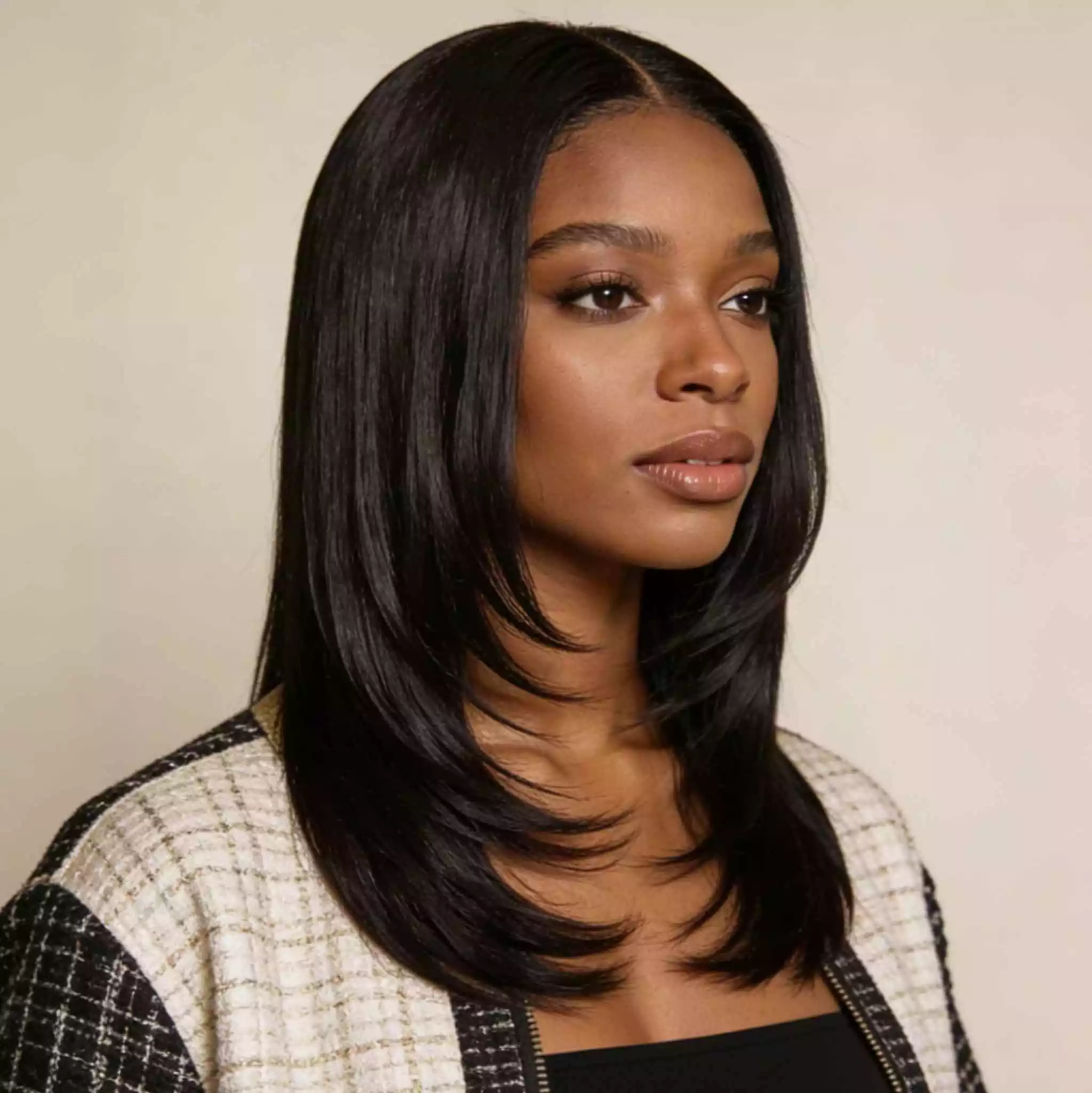 straight layered sew-in for black women with long smooth lengths, soft layers, and natural movement