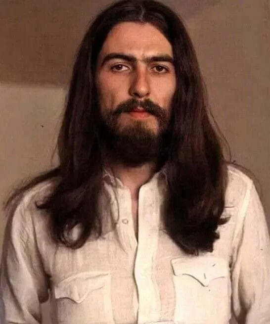 George Harrison with long hair and beard, iconic 1970s look