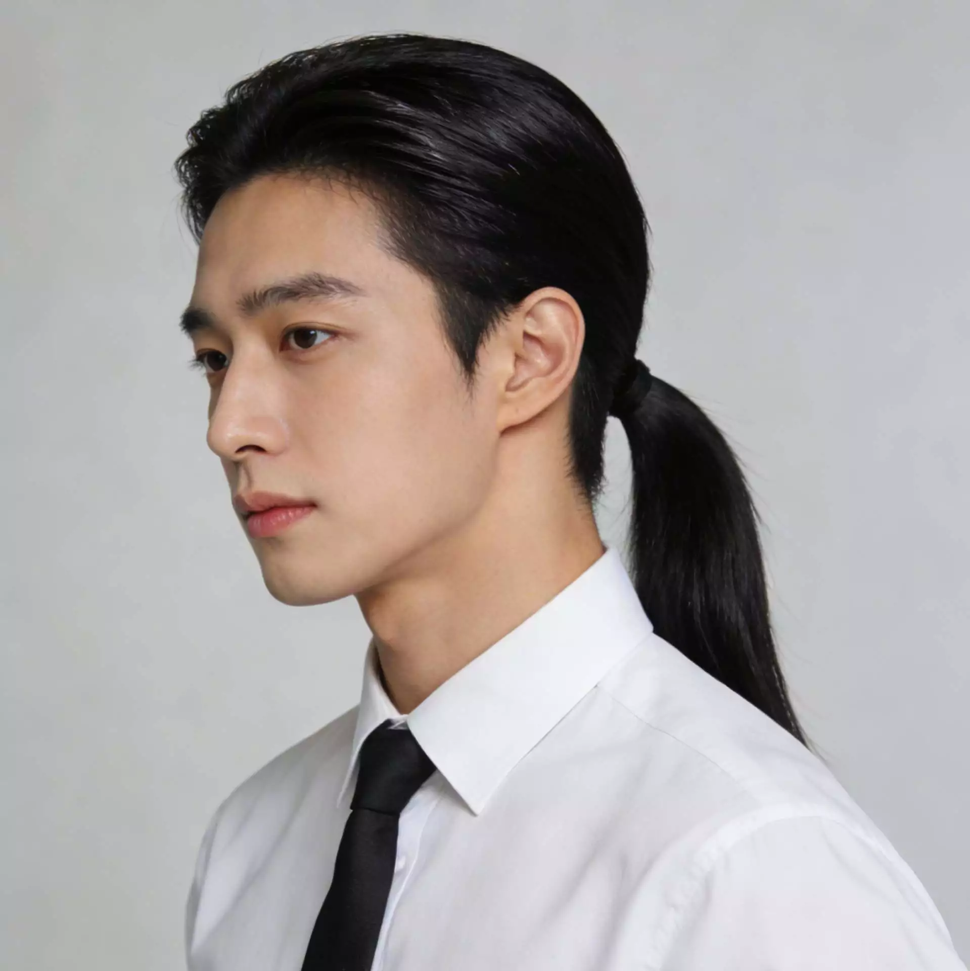 Asian men tied-back long hair — low ponytail style for office and daily wear, 2026