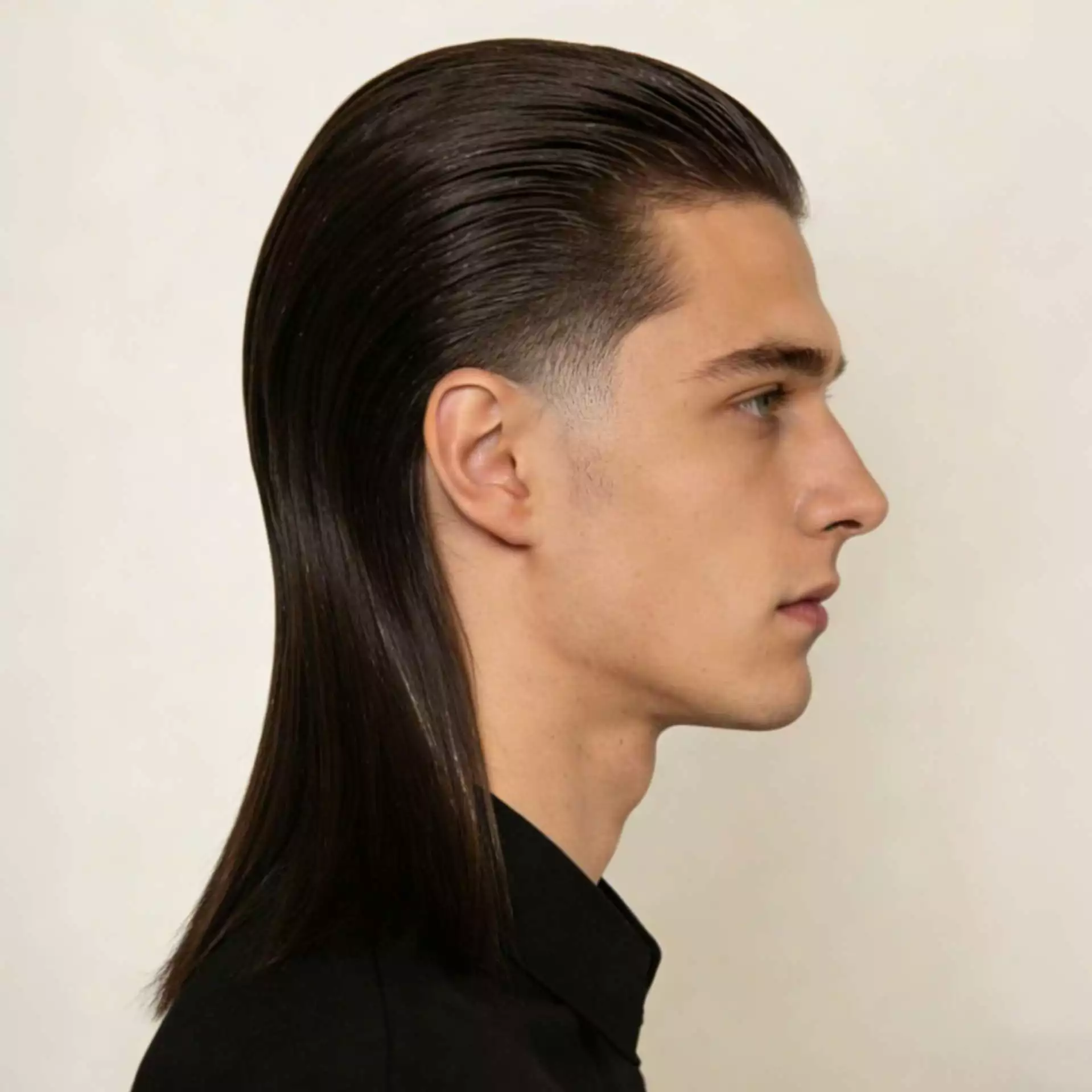 slick back low taper with long straight hair men — polished brushed-back top with clean low taper and soft shine