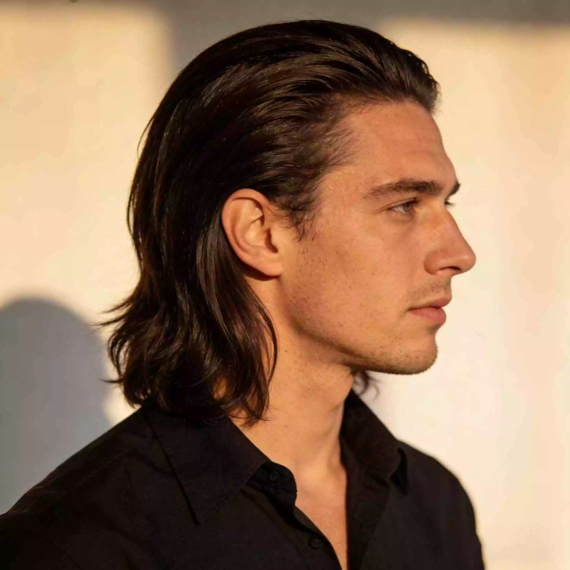 straight bro flow — ear-to-collarbone length — brushed back flow with tidy outline