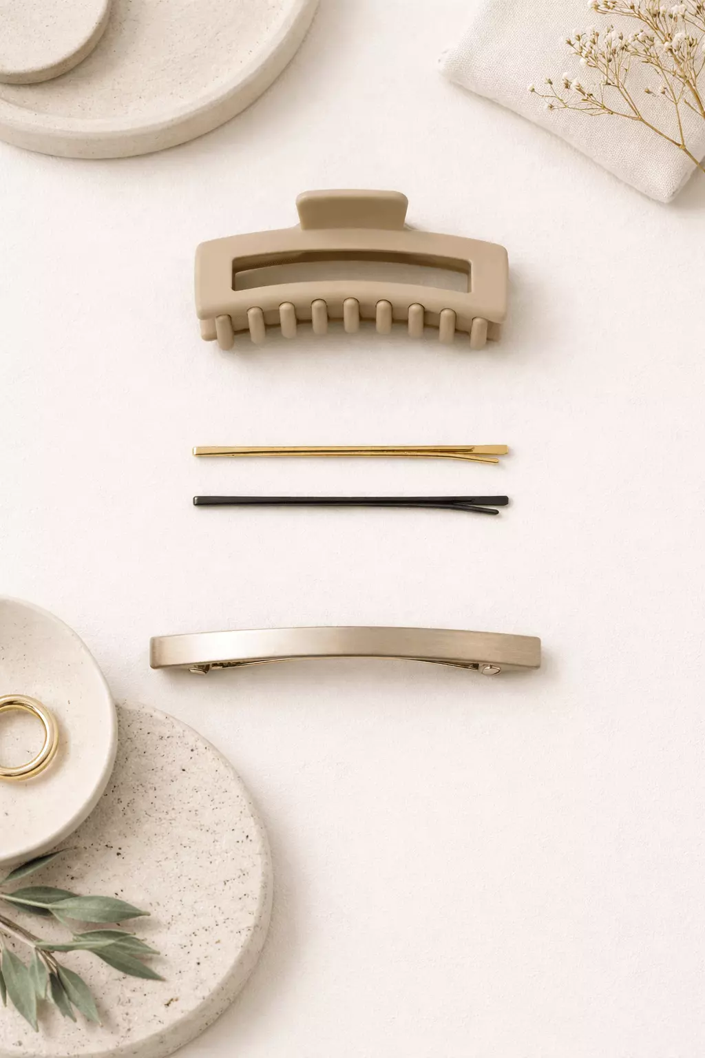 Minimal office hair accessories for long hair: neutral claw clip, slim pins, understated barrette; mobile-friendly vertical layout