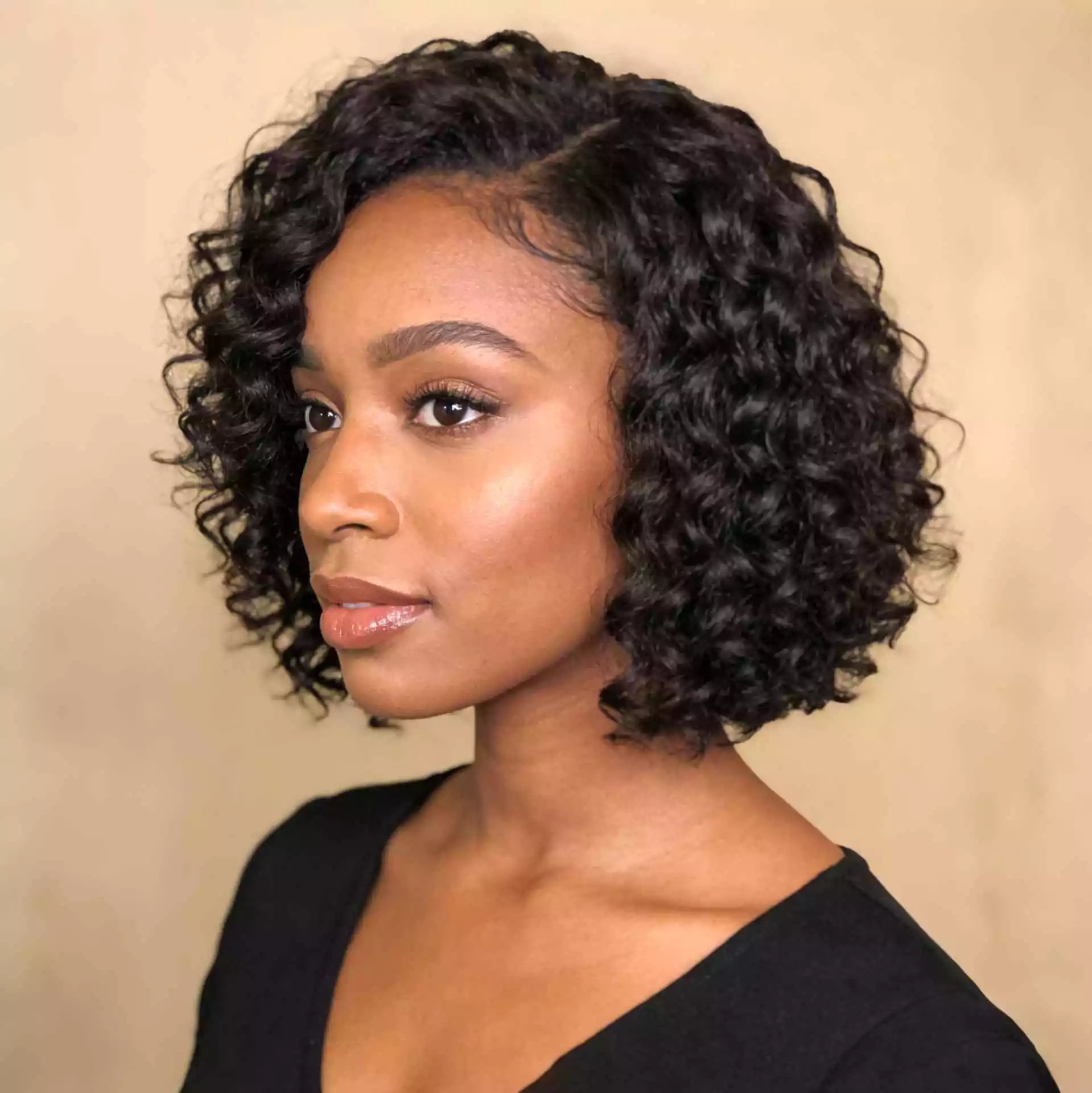 curly jaw-length bob for black women with soft shape and defined short curls