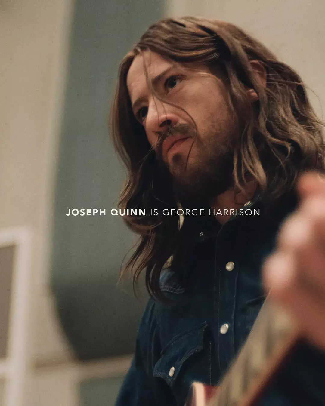 Joseph Quinn as George Harrison in 2026 Beatles biopic first look, voluminous long waves and beard